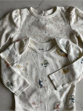Lot of 2 Pehr Cream Long-Sleeve Baby Bodysuits. Zodiac and Secret garden prints